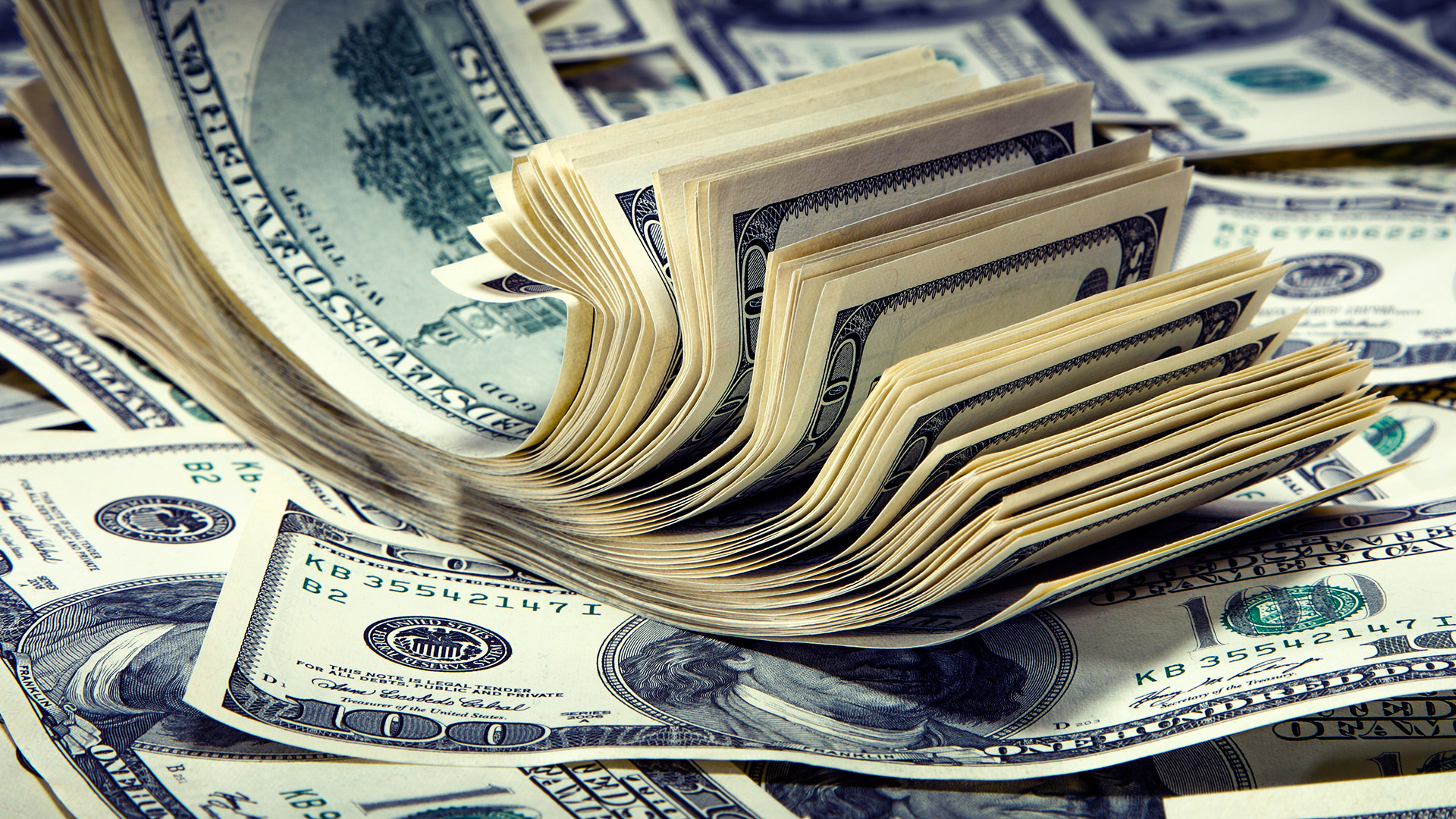 A bundle of 100 US dollars amid The Dollar Dominates after Powell's Remarks