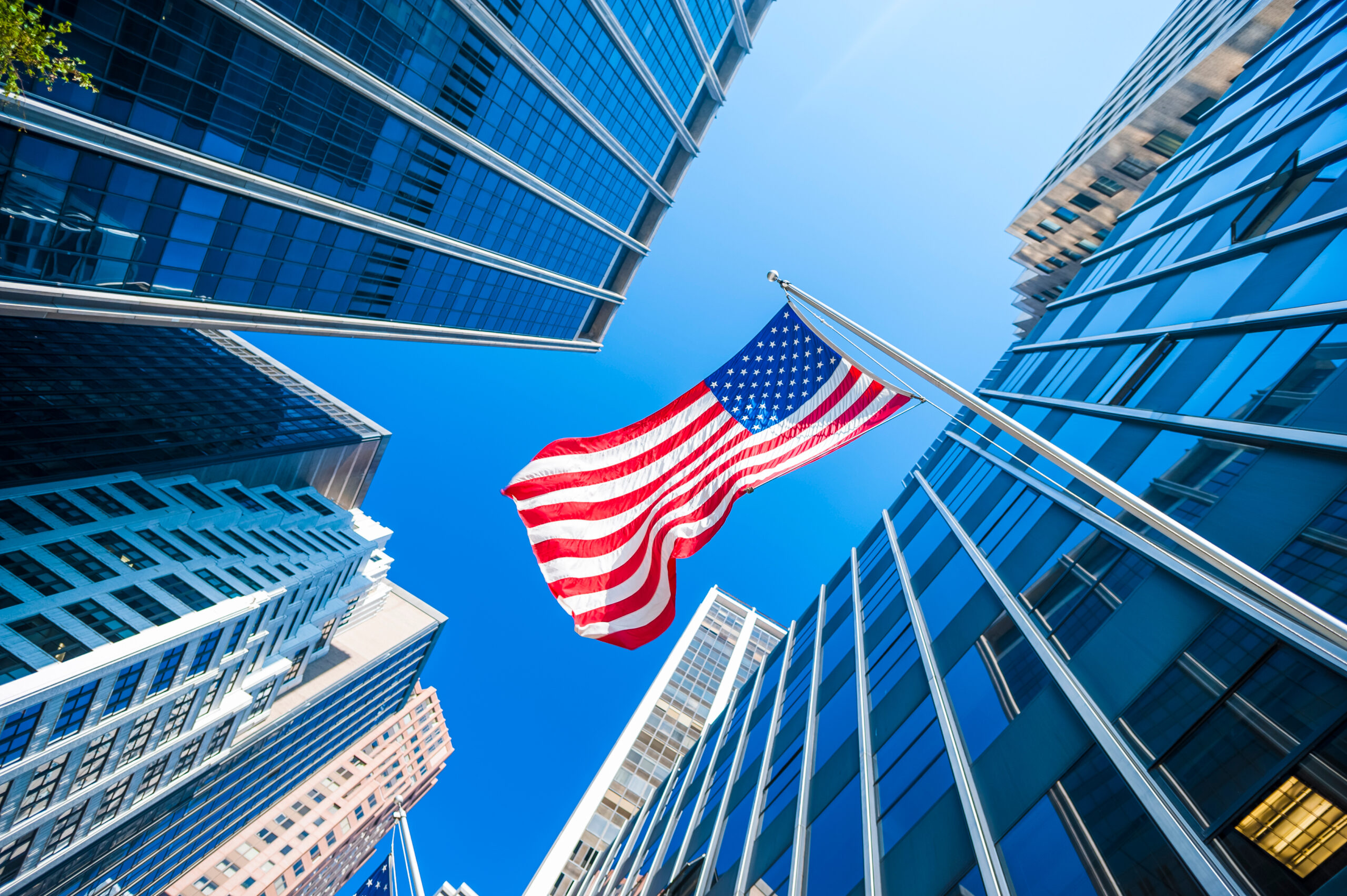 US Flag in Wall Street amid Optimism in the US Markets
