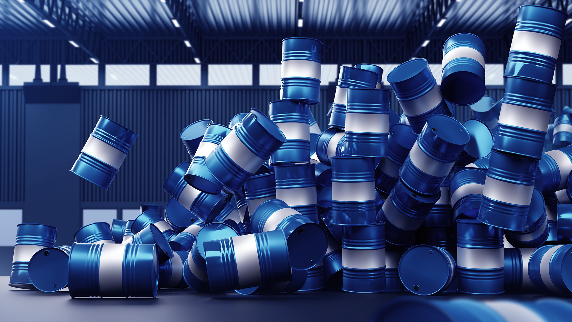 Pile of blue crude oil barrels amid Oil Is Below $70 Levels